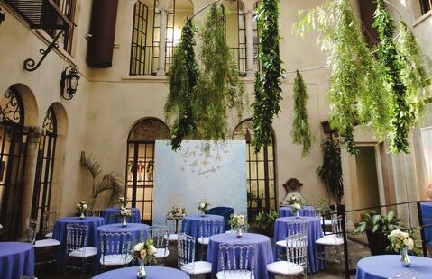 An elegant event catering reception setup in the courtyard of the Riverside Art Museum.