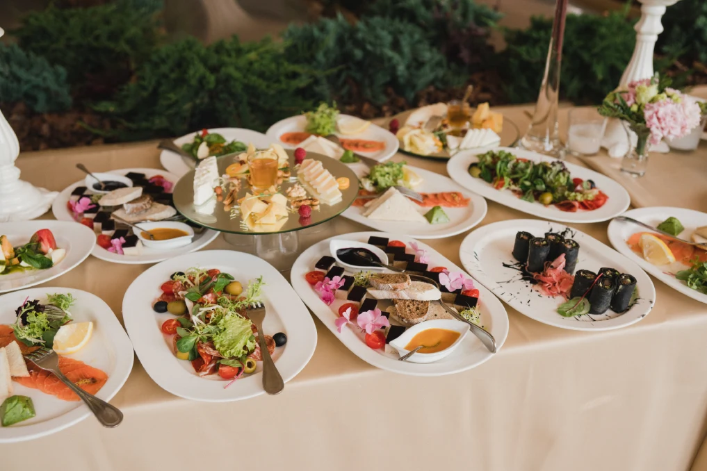 An extensive wedding buffet catering spread with diverse dishes for events in Riverside County.