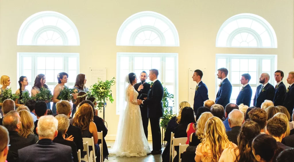 An indoor wedding ceremony catered by Bamboo Island Catering at the Riverside Art Museum.